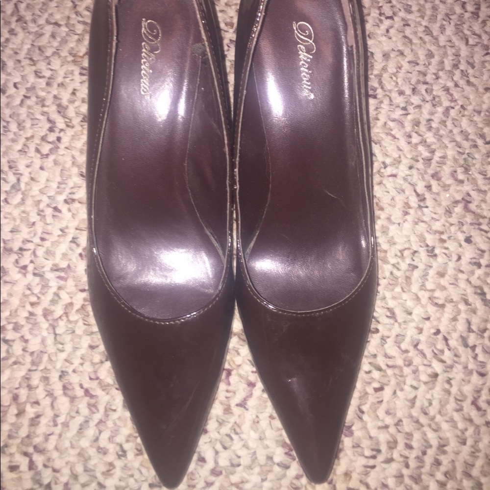 Chocolate brown heels with pointed tips.